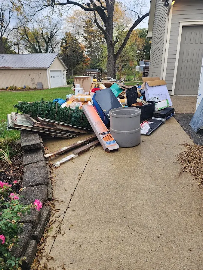 Dumpster being loaded with debris for Residential Dumpster Rental in Wausau